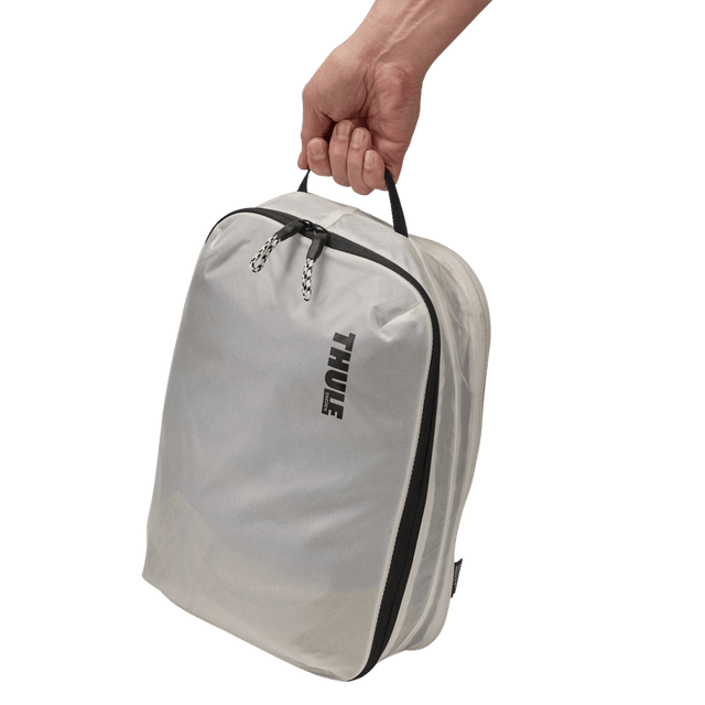 Thule clean dirty packing cube white sitting inside carry-on luggage