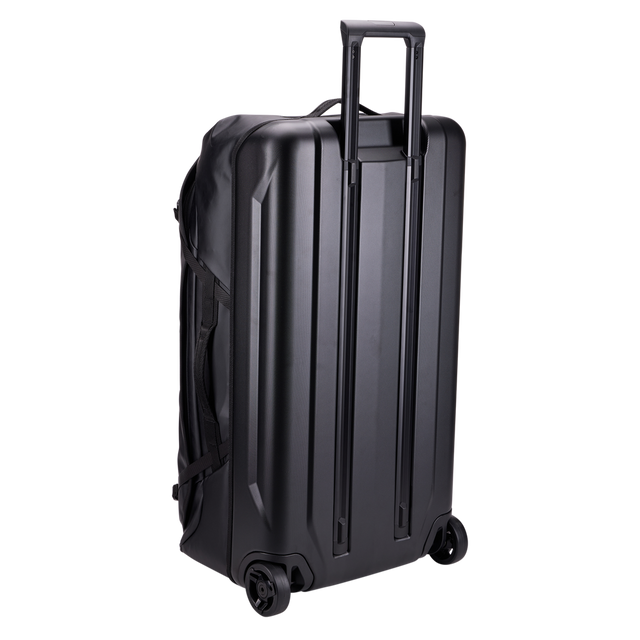 Thule Chasm rolling duffel 110L black, rear view with oversized wheels