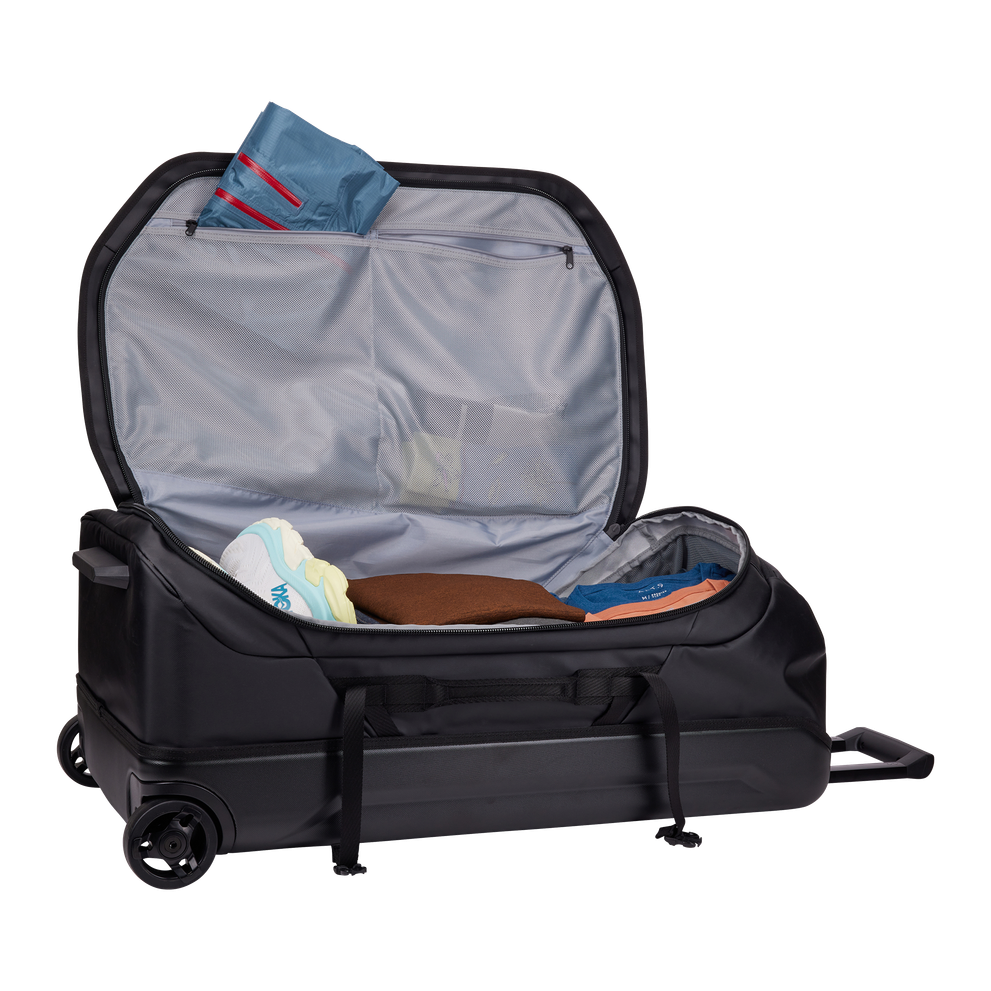 Thule Chasm rolling duffel 110L black showing external compression straps