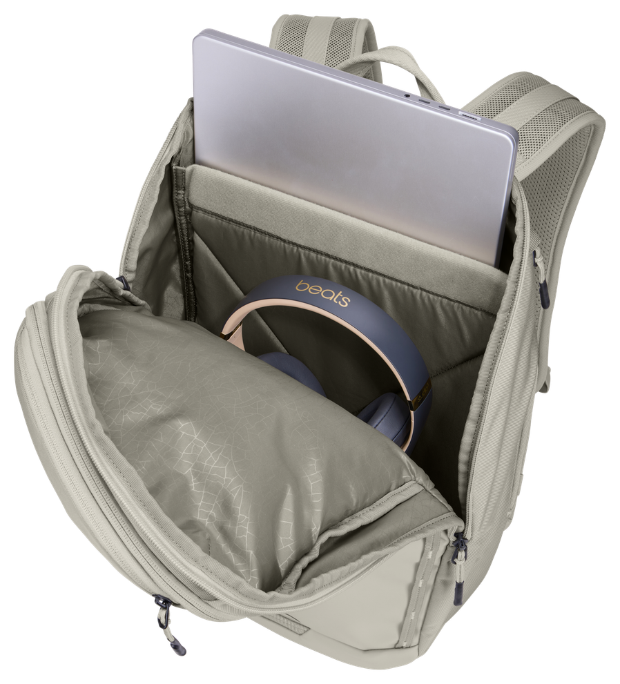 Thule Chasm laptop backpack 26L in Soft Sand, side zip open to reach the padded laptop sleeve