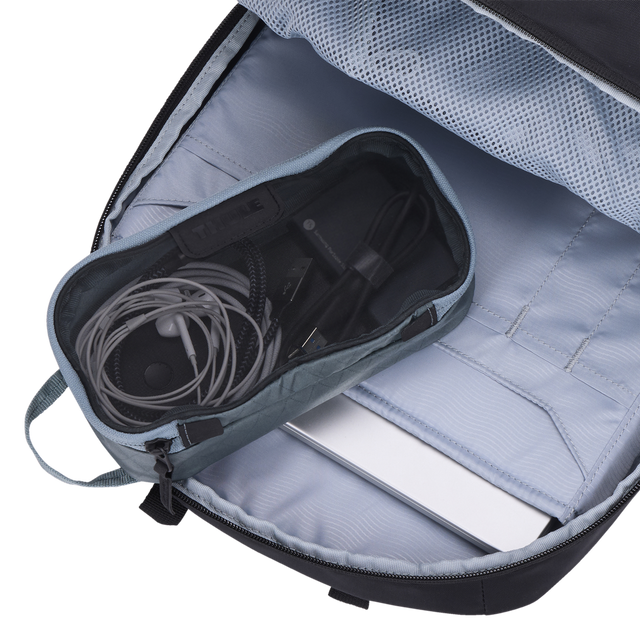 Thule packing cube x-small in Pond Gray, packed inside a daypack