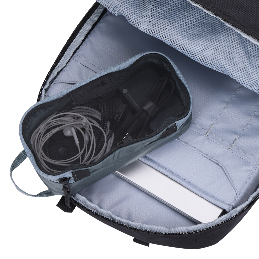 Thule packing cube x-small in Pond Gray, packed inside a daypack