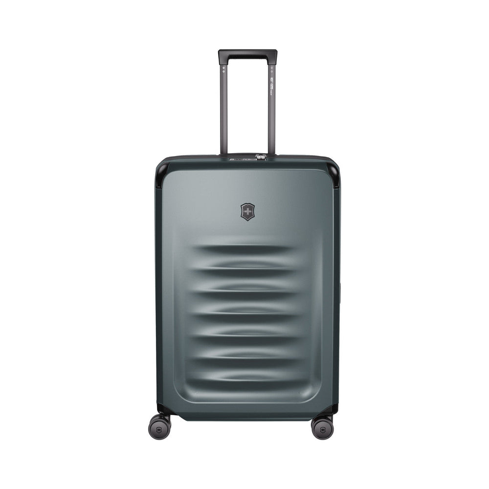 Gray hardshell rolling suitcase with horizontal ridges on the front.