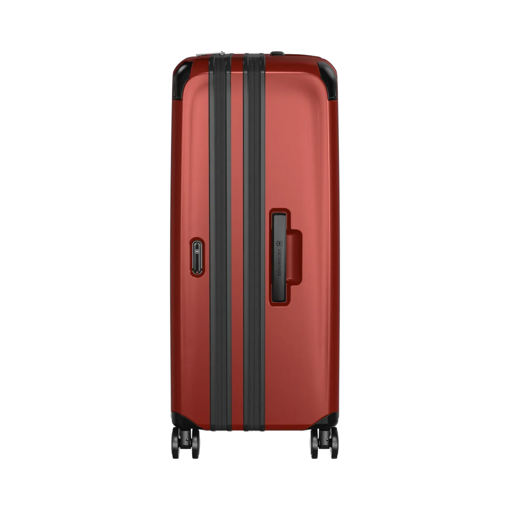 Red hardshell suitcase with black trim and wheels.