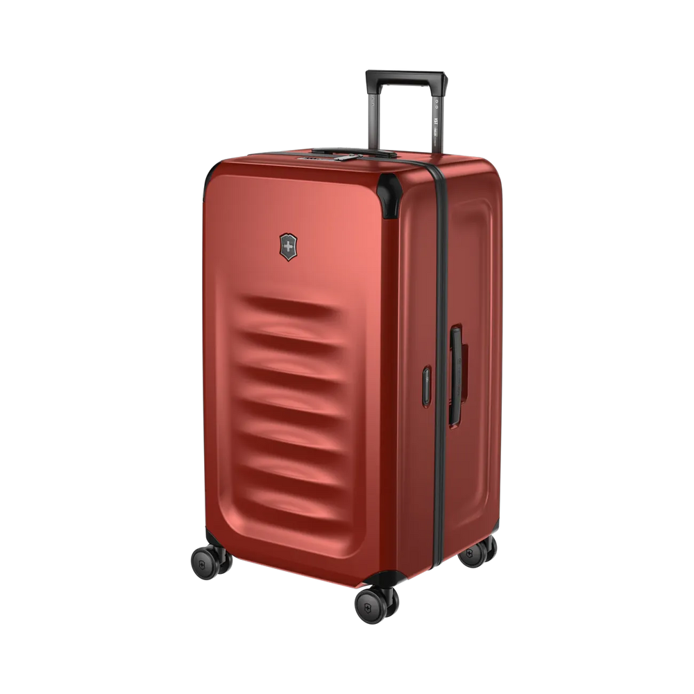 Red hardshell rolling suitcase with horizontal ridges and a retractable handle.