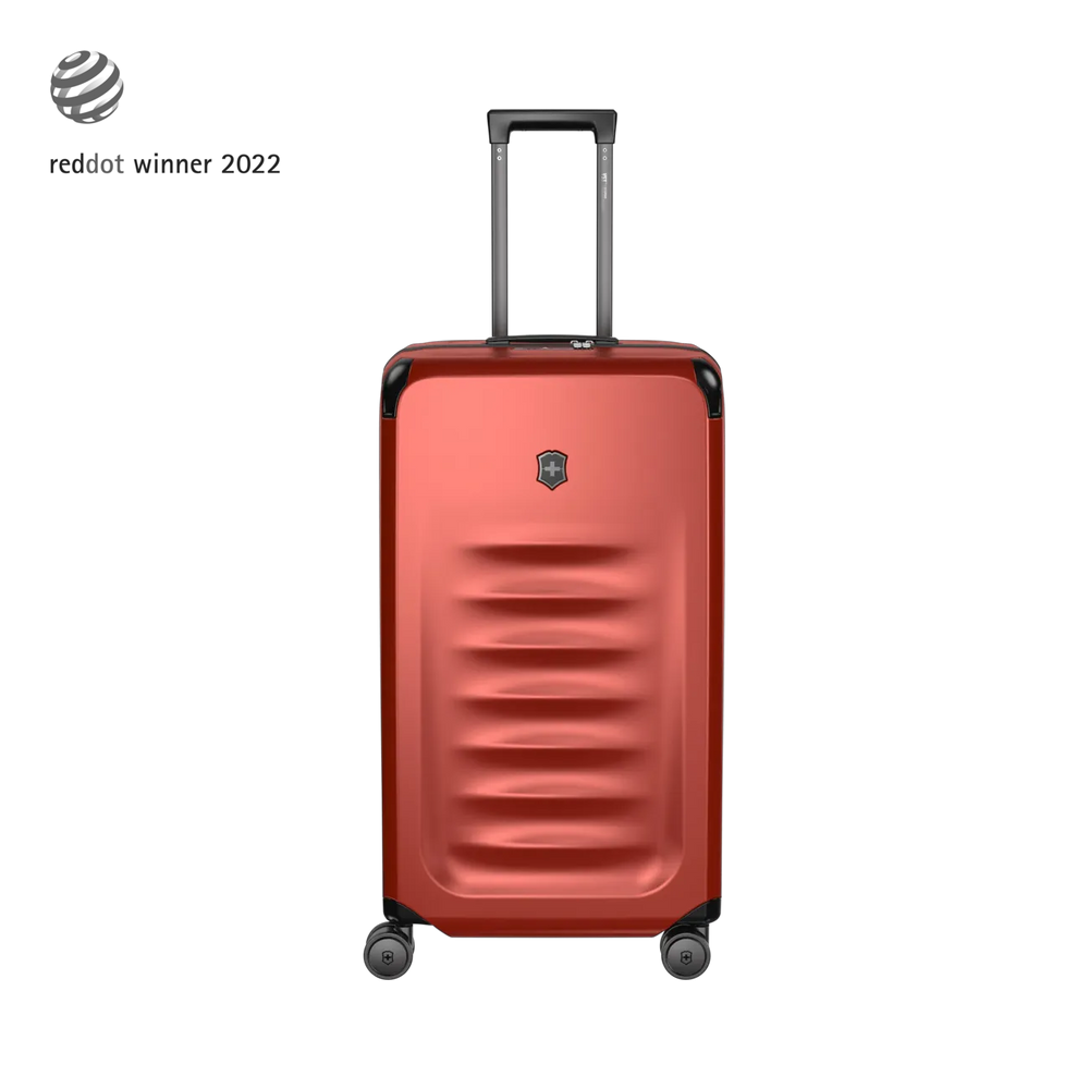 Red hardshell rolling suitcase with horizontal ridges and a retractable handle.