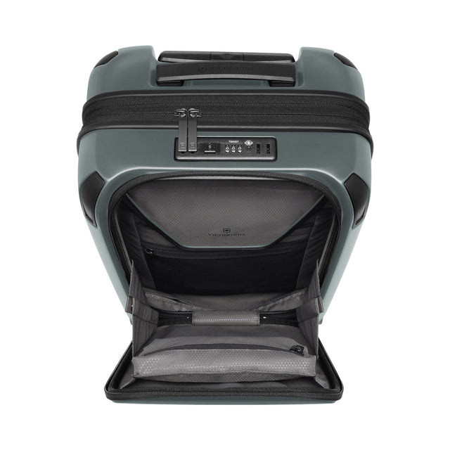 Hard-shell rolling suitcase with an open front compartment.