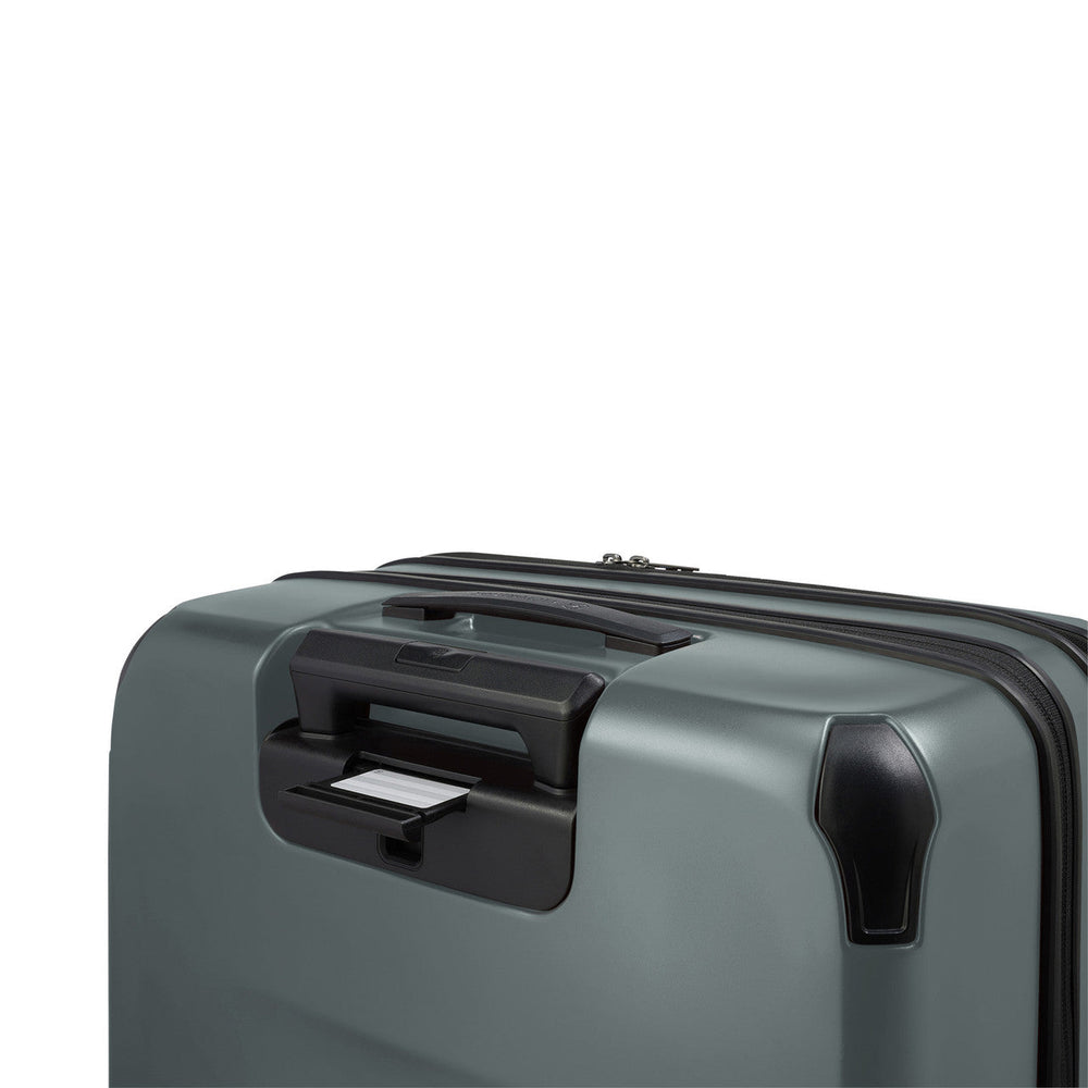 Gray hardshell suitcase with a retractable handle and corner protection.