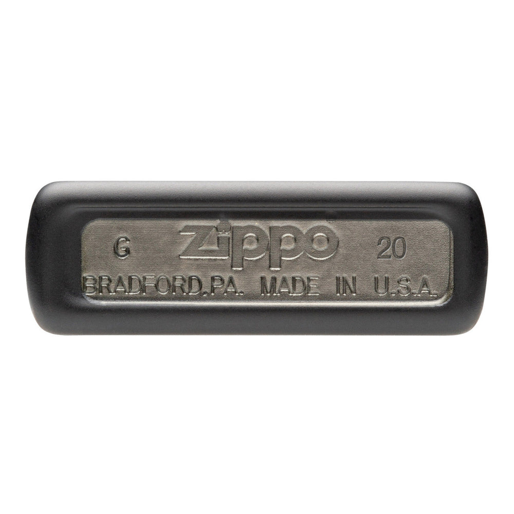 Zippo lighter bottom with embossed text showing brand and origin details.