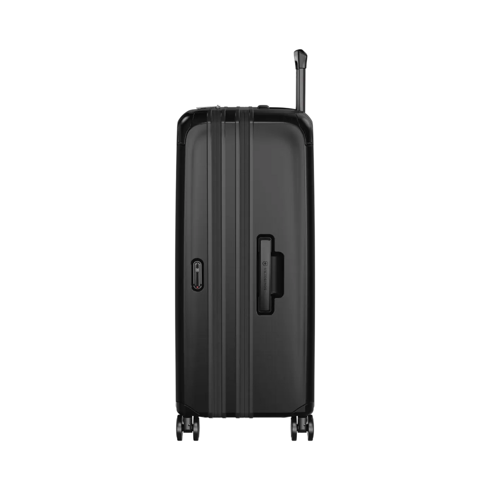 Black hardshell rolling suitcase with vertical ridges and extendable handle.
