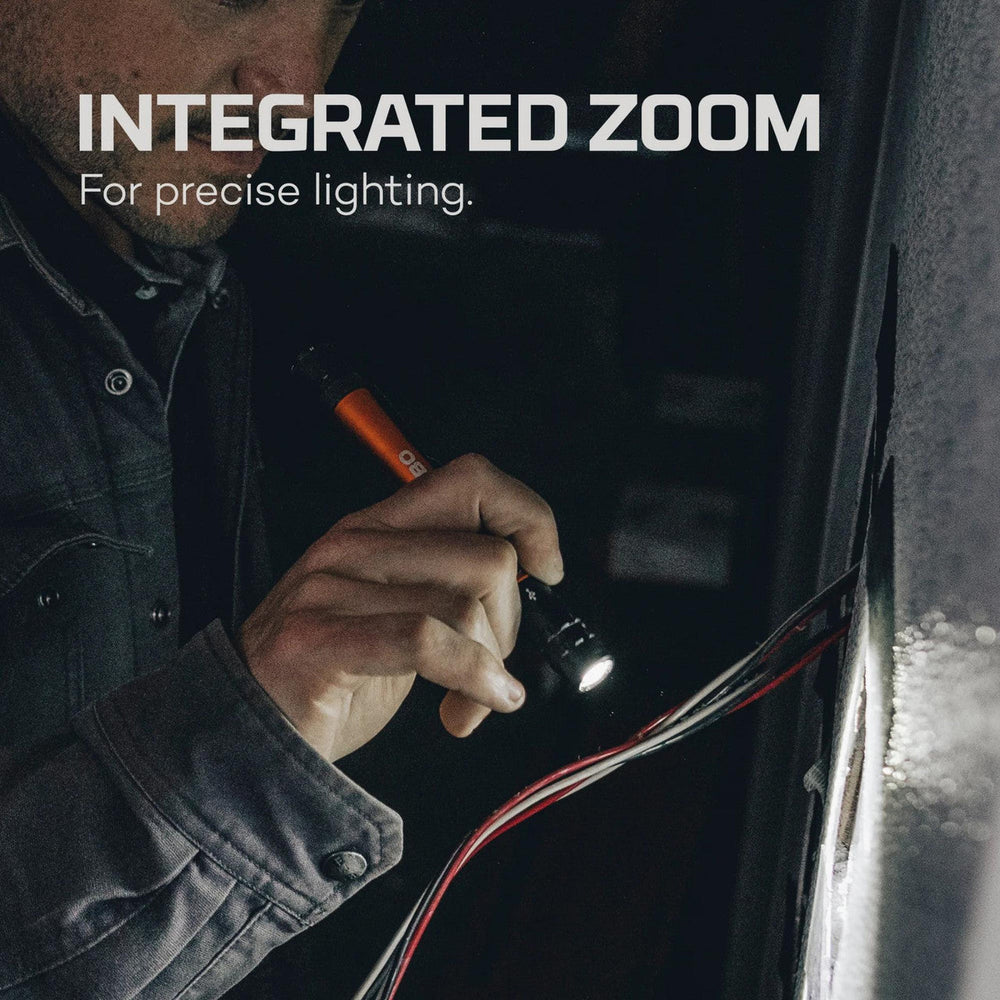 Handheld flashlight with integrated zoom feature for precise lighting.
