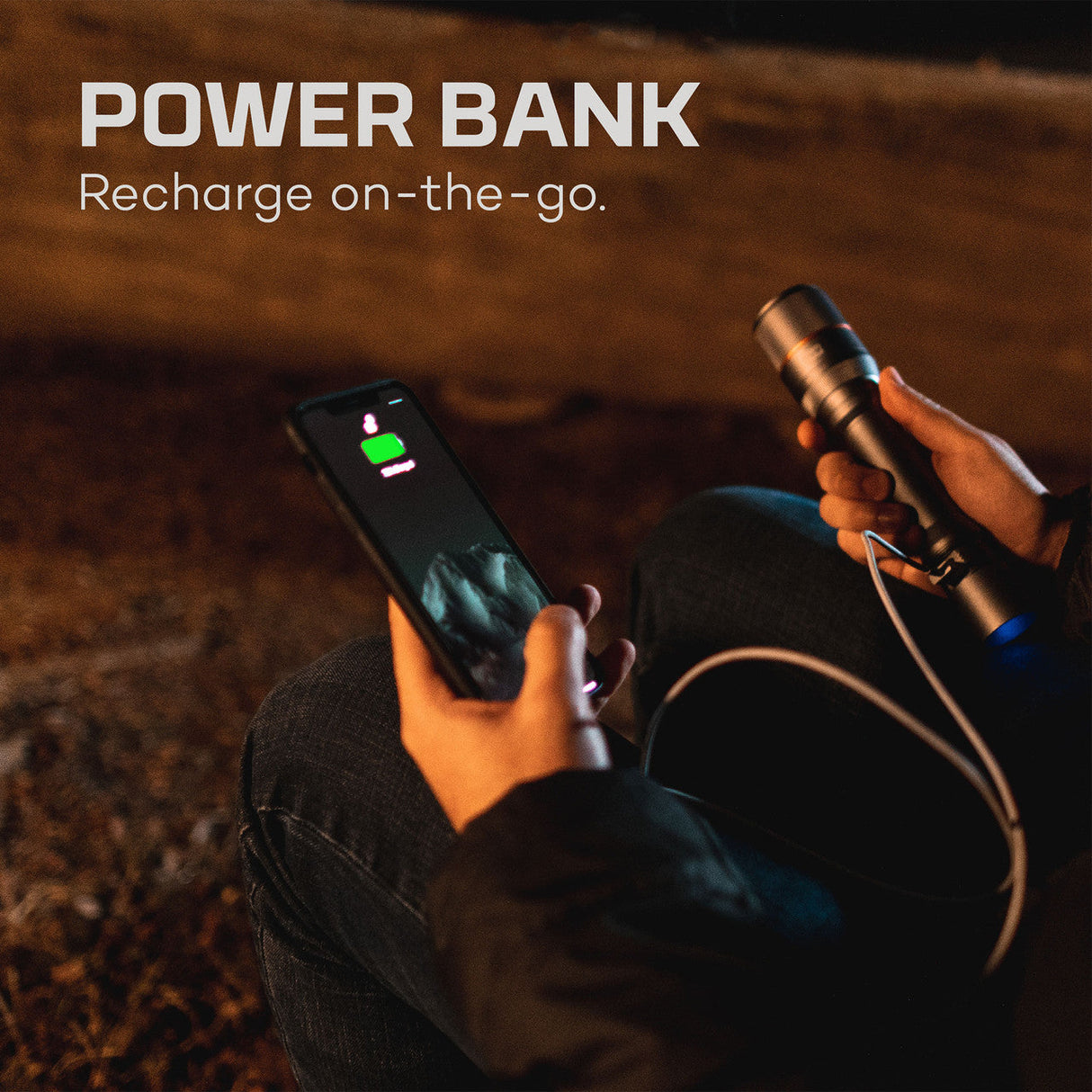 Power bank connected to a smartphone for charging on-the-go.