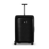 Black hard-shell rolling suitcase with horizontal ridges and an extendable handle.