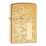 Gold-colored Zippo lighter with an ornate floral engraving pattern.