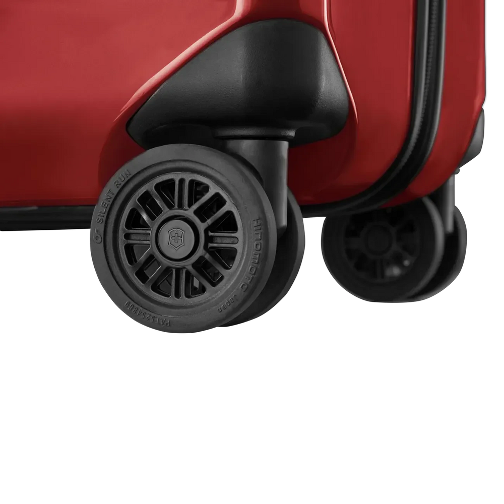 Wheels of a red suitcase or luggage.
