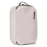 Thule clean dirty packing cube white, angled view with webbing handle