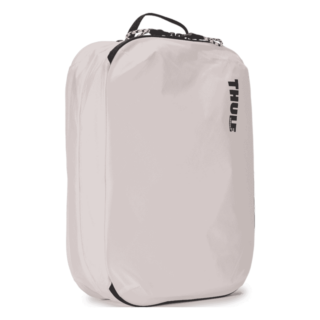 Thule clean dirty packing cube white, angled view with webbing handle