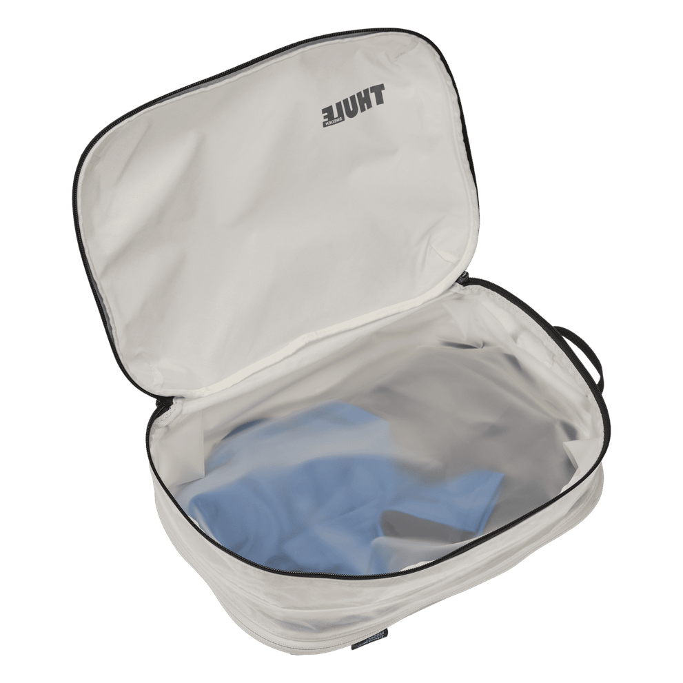 Thule clean dirty packing cube white packed with clothes on both sides