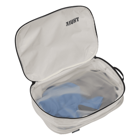 Thule clean dirty packing cube white packed with clothes on both sides