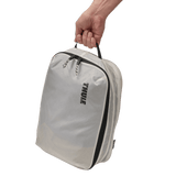 Thule clean dirty packing cube white sitting inside carry-on luggage