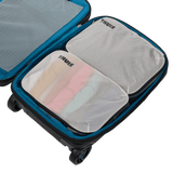Thule clean dirty packing cube white held by its webbing handle
