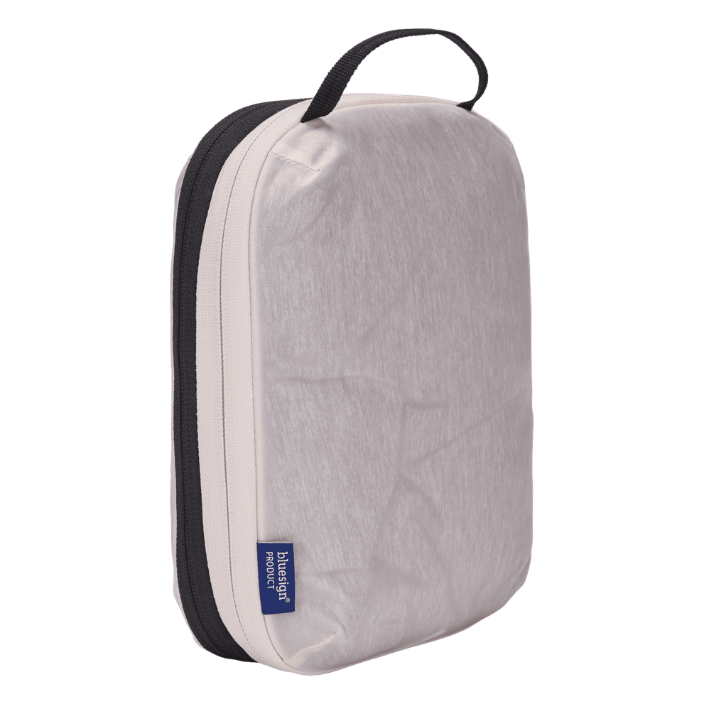 Thule compression packing cube small in white, compressed down to 3 cm deep