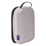 Thule compression packing cube small in white, compressed down to 3 cm deep