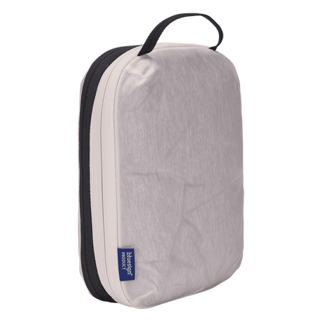 Thule compression packing cube small in white, compressed down to 3 cm deep