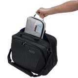 Thule compression packing cube small in white, several cubes arranged inside carry-on luggage