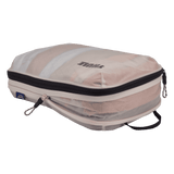 Thule compression packing cube medium in white, expanded and filled with folded clothing
