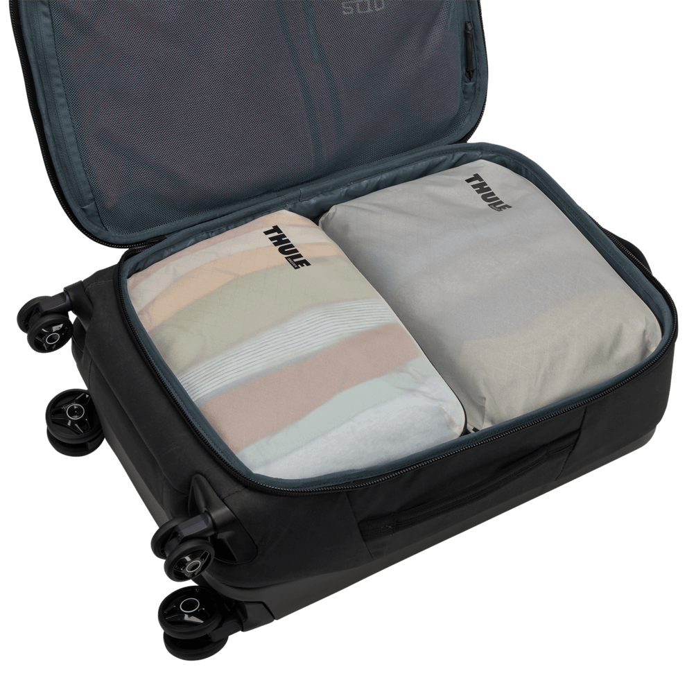 Thule compression packing cube medium in white, semitransparent panel showing the contents