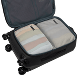 Thule compression packing cube medium in white, semitransparent panel showing the contents