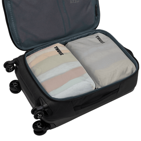 Thule compression packing cube medium in white, semitransparent panel showing the contents