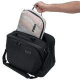 Thule compression packing cube medium in white, packed inside a suitcase