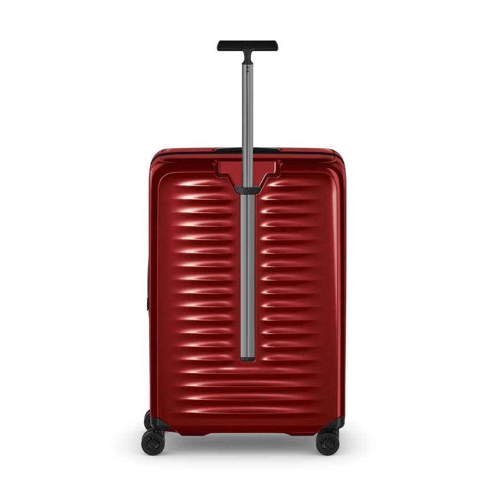 Red hardshell rolling suitcase with horizontal ridges and an extendable handle.