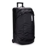 Thule Chasm rolling duffel 110L black, angled view with handle extended