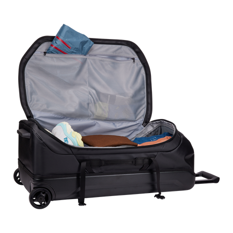 Thule Chasm rolling duffel 110L black showing external compression straps