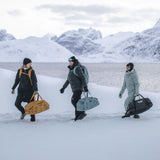 Thule Chasm duffel 30L black carried on a shoulder outdoors