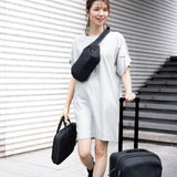 Thule Subterra 2 laptop attaché black worn with the removable shoulder strap