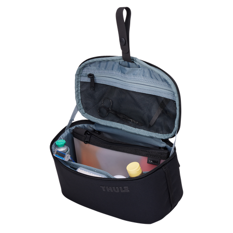 Thule Subterra 2 toiletry bag black hanging from its stowable hang strap