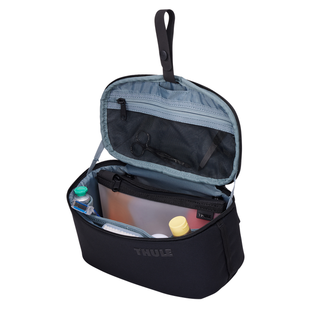 Thule Subterra 2 toiletry bag black hanging from its stowable hang strap