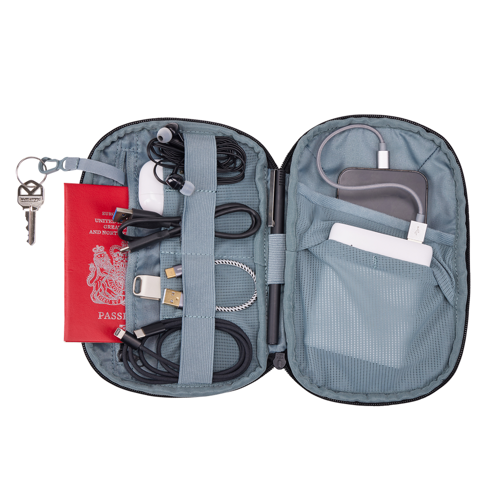 Thule Subterra 2 PowerShuttle Medium black, exterior slip pocket holding a passport