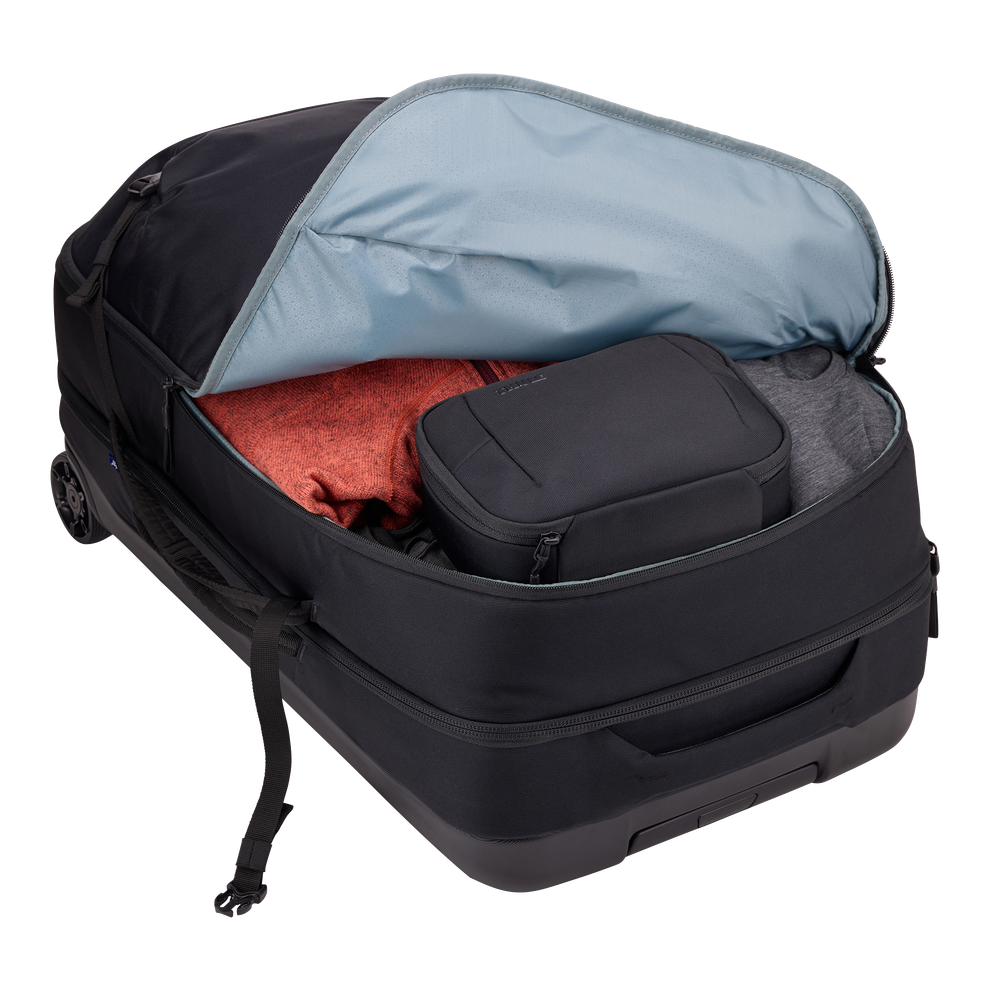 Thule Subterra 2 wheeled duffel black, opened to show the fold-flat divider