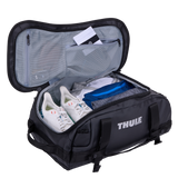 Thule Chasm duffel 30L black opened wide, internal mesh pockets