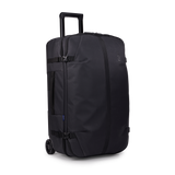 Thule Aion wheeled duffel 70cm black, angled view with telescoping handle extended