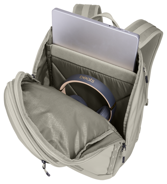 Thule Chasm laptop backpack 26L in Soft Sand, side zip open to reach the padded laptop sleeve