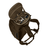 Thule Landmark 60L travel pack in deep khaki, worn on the back on a trail