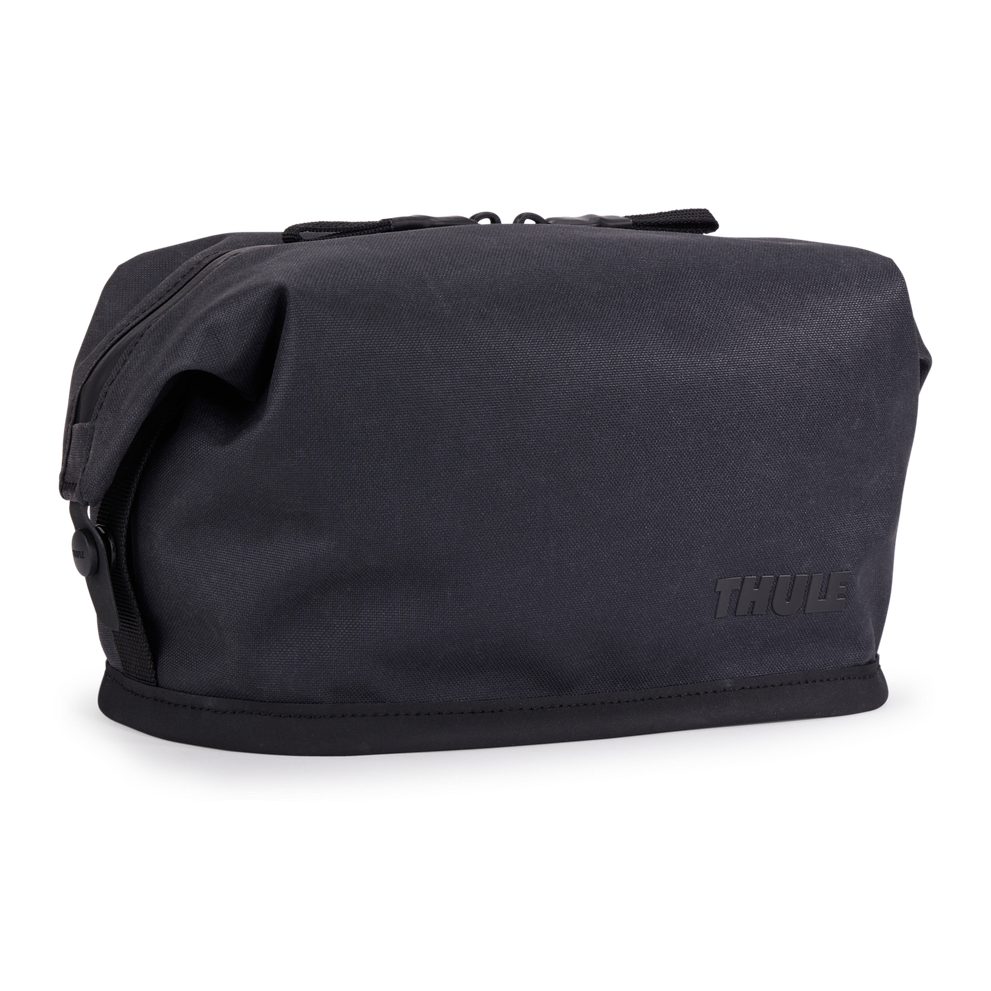 Thule Aion toiletry bag black, angled view with hang strap stowed