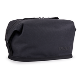 Thule Aion toiletry bag black, angled view with hang strap stowed