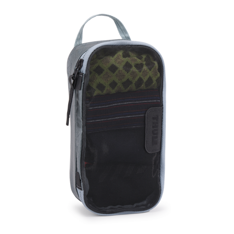 Thule packing cube x-small in Pond Gray, top-down view of the semi-transparent mesh panel